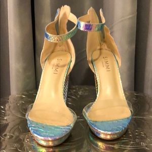 Rainbow holographic chunky heels.